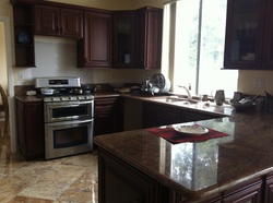 Mahogany Maple cabinets with Rose Lady counter top